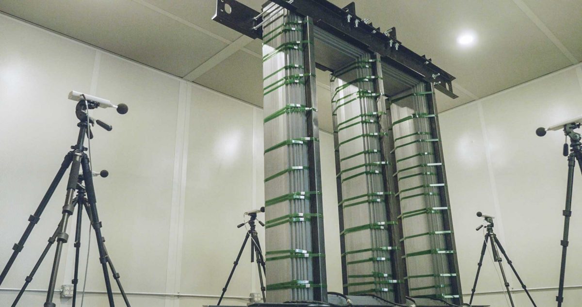 Corefficient sound testing booth, multiple microphones positioned around a transformer core