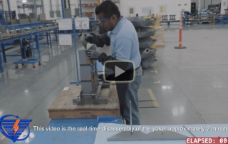 Video frame image of Corefficient employee disassembling a transformer core top yoke.