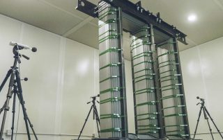 Corefficient sound testing booth, multiple microphones positioned around a transformer core